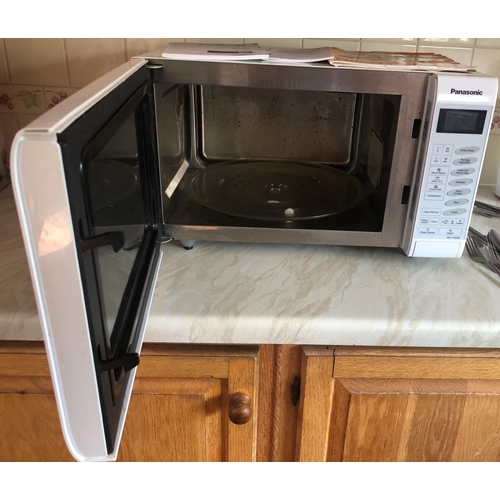 7198 - A Panasonic microwave oven, model NN-CT555W, serial no. 5C76051282 with manual and recipe book, 51cm... 