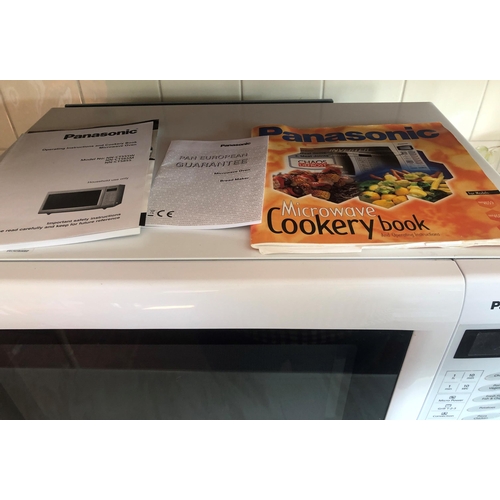 7198 - A Panasonic microwave oven, model NN-CT555W, serial no. 5C76051282 with manual and recipe book, 51cm... 