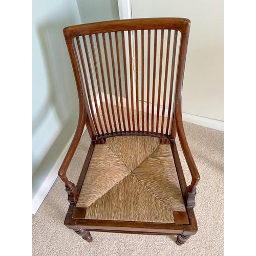 7220 - A 19/20th Century mahogany armchair with slatted back and drop-in rush seat (dropped), width 47cm (w... 