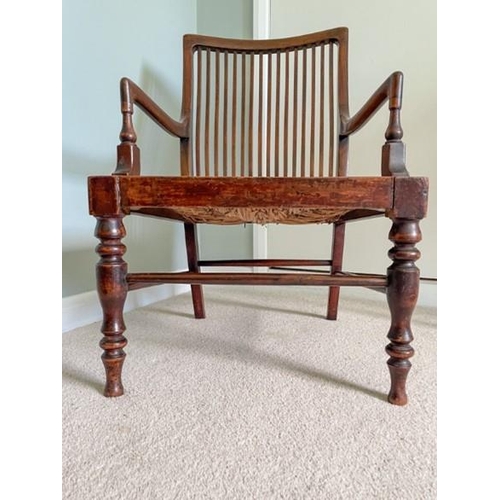 7220 - A 19/20th Century mahogany armchair with slatted back and drop-in rush seat (dropped), width 47cm (w... 