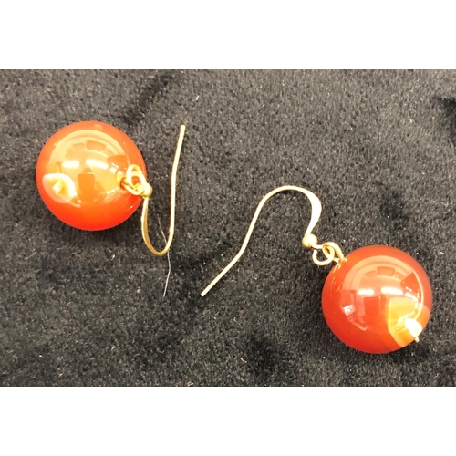 7243 - A pair of red jade bead earrings