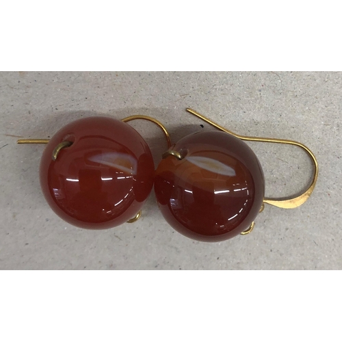 7243 - A pair of red jade bead earrings