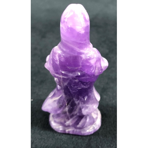 7246 - A purple stone deity, 6.5cm high