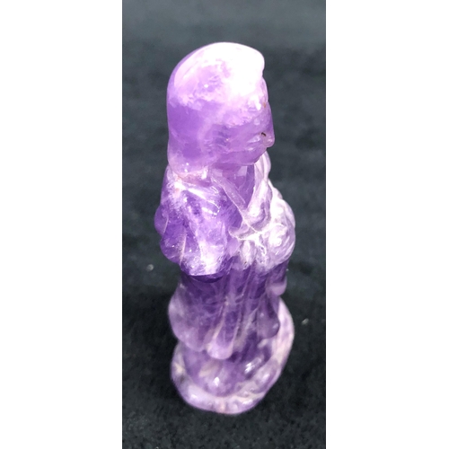 7246 - A purple stone deity, 6.5cm high