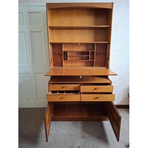 7266 - A G-Plan Nathan teak cabinet with open shelves, hidden light, hinged door to interior writing desk a... 