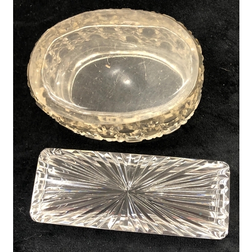 7052 - A silver topped rectangular glass dressing table bottle, 10cm wide, and a silver topped oval glass d... 