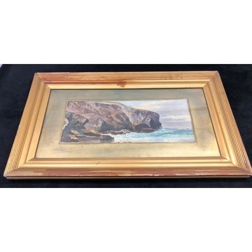 7053 - A watercolour of rocks and sea, 49 x 20cm in gilt frame. (Stains and chips to frame).