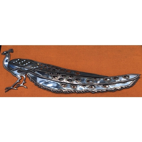 7094 - A stainless steel Peacock on fabric background and in wood frame, circa 1960, 100.2 x 42cm overall