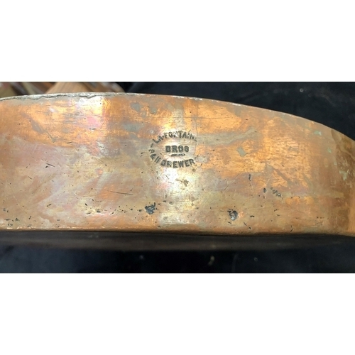 7064 - A heavy copper and brass pan, stamped Kettners to side, 37.5cm diameter excluding handles, a rectang... 