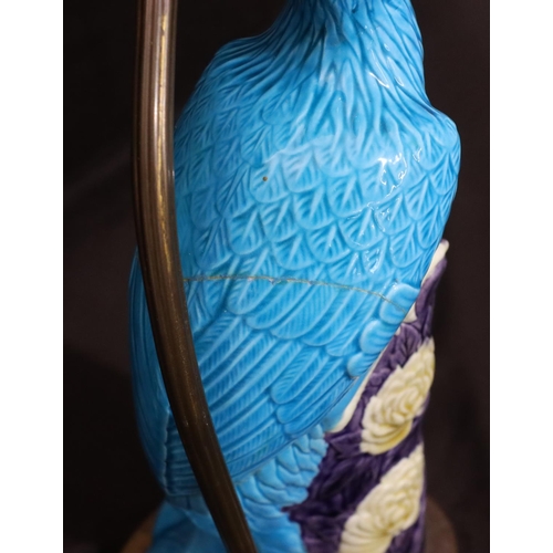 128 - An Oriental table lamp in the form of a perched bird on purple, turquoise and white ground, mounted ... 