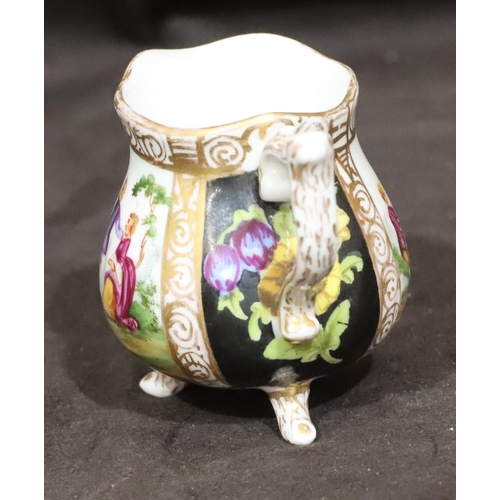 152 - A small 19th Century late Meissen small round bulbous shaped jug on white and black ground with mult... 