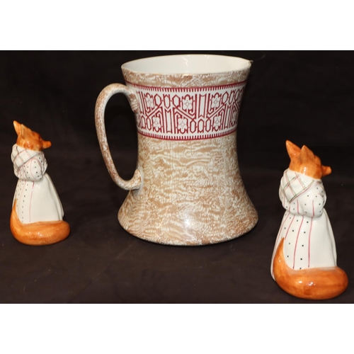 160 - A Bisto large china round bulbous shaped jug on brown ground with red leaf decoration, 23cm high and... 