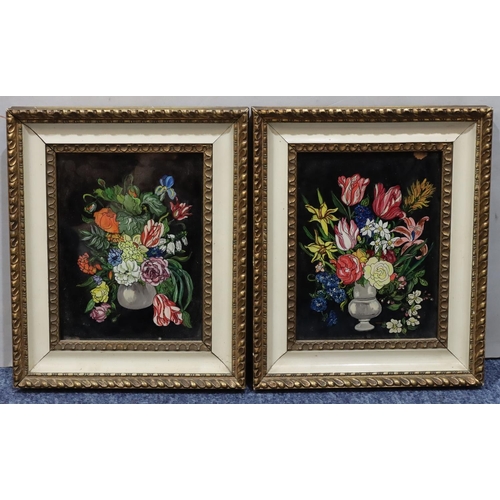 199 - A pair of oil on glass still life vases of flowers,16 x 12cm in white and gilt frames. (Slight wear ... 