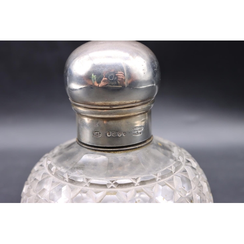 338 - A Victorian cut glass round bulbous shaped scent bottle with silver screw lid, London 1885, makers m... 