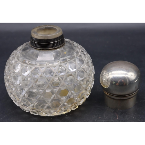 338 - A Victorian cut glass round bulbous shaped scent bottle with silver screw lid, London 1885, makers m... 