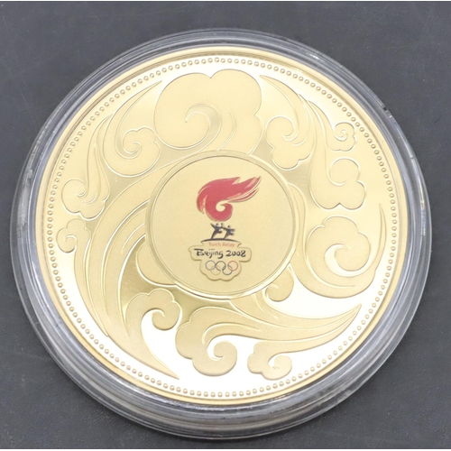 387 - A Beijing 2008 Olympics medallion (Boxed and with certificates)