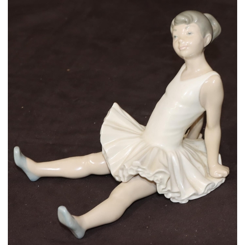 85 - A Nao figure of a seated young ballerina, 14.5cm high