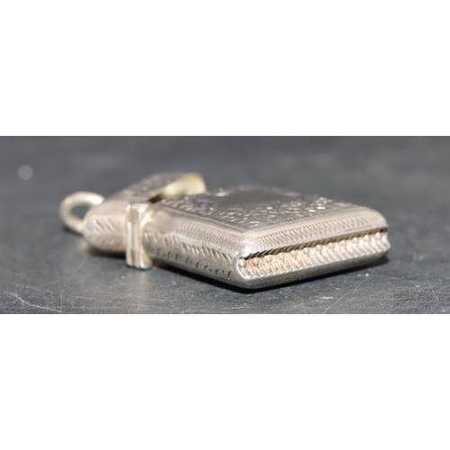 221 - A small Victorian silver vesta case with allover chased and leaf decoration and hinged lid, Birmingh... 