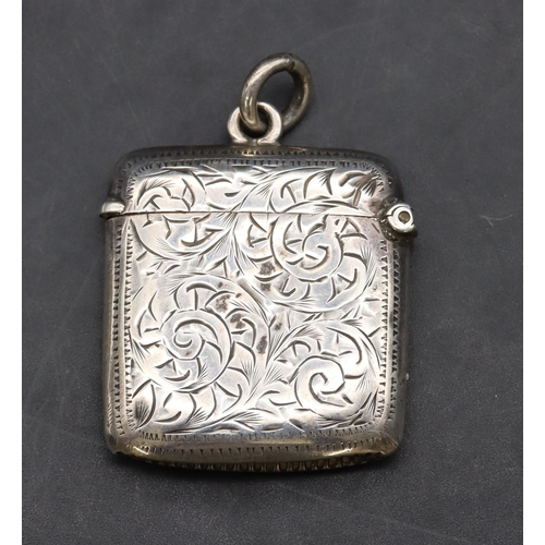 226 - An Edward VII silver small vesta case with allover chased scroll and leaf decoration and hinged lid,... 