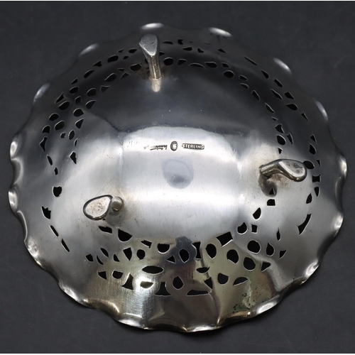 263 - A Chinese sterling silver round scallop shaped bowl with pierced rim depicting dragon motif on 3 spl... 