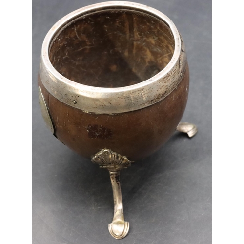 268 - A Georgian silver coloured metal mounted coconut cup on splayed feet, 10cm high