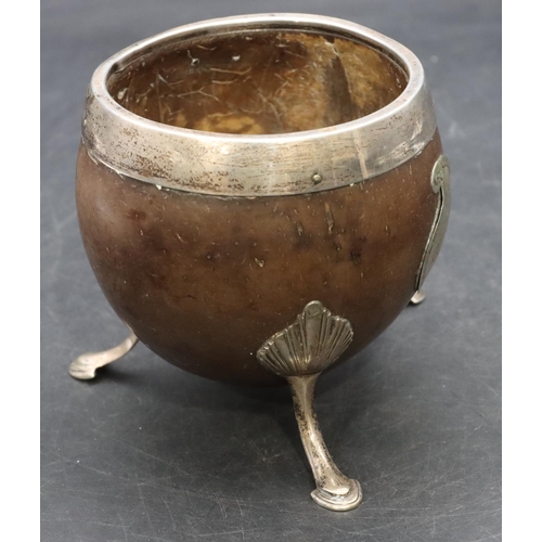 268 - A Georgian silver coloured metal mounted coconut cup on splayed feet, 10cm high