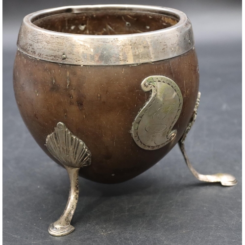 268 - A Georgian silver coloured metal mounted coconut cup on splayed feet, 10cm high