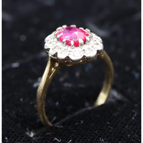 441 - An 18ct gold ladies' oval cluster ring set with centre ruby surrounded by diamonds, size K, 3.3 gram... 