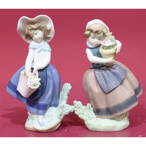 18 - 2 Lladro figures of ladies holding encrusted floral baskets, 18cm high