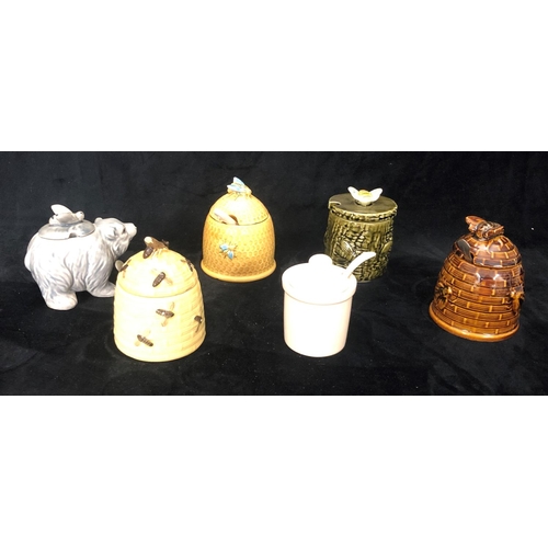 8002 - 5 various honey pots with lids, 4 small spoons and a mustard pot with lid and spoon.