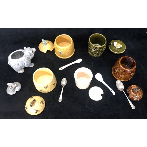 8002 - 5 various honey pots with lids, 4 small spoons and a mustard pot with lid and spoon.