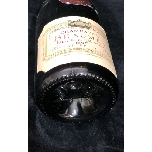 8011 - A Bottle of Beaumet Blanc de Blanc Grand Cru Champagne.