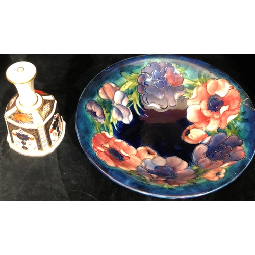 8030 - A Moorcroft dish, 25cm diameter (chipped to edge and 2 cracks to side) and a Royal Crown Derby hand ... 