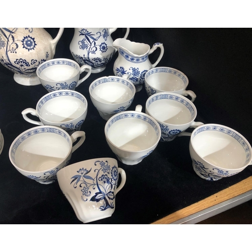 8033 - J & G Meakin Blue Nordic pattern service, 1 large jug, 1 smaller jug, 2 sugar bowls (1 chipped), 4 d... 