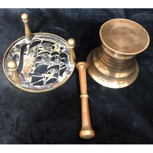 8035 - A brass HMS Victory trivet, 15cm diameter, 7cm high and a bronze pestle and mortar, top 12cm diamete... 