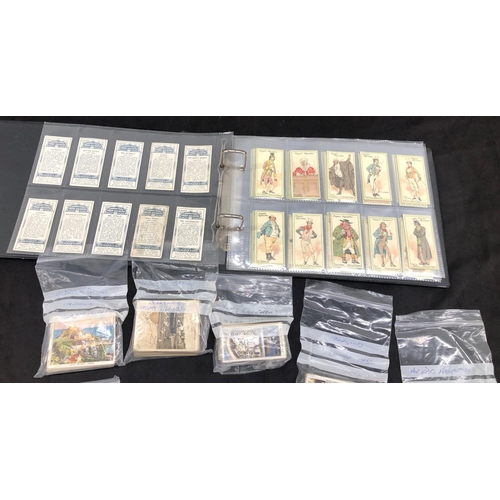 8043 - A quantity of various cigarette cards and an album of John Player & Sons cigarette cards of Characte... 