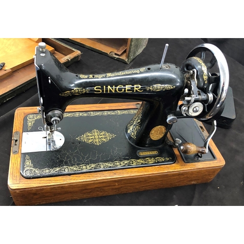 8058 - A vintage Singer hand operated sewing machine numbered EC96572, with various accessories and hard ca... 