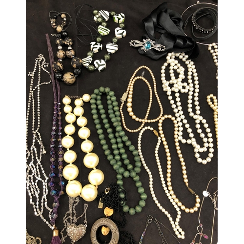 8067 - A large quantity of costume jewellery, necklaces, brooches, bracelets, earrings, etc.