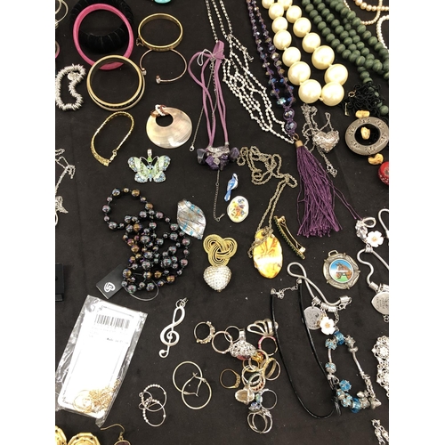 8067 - A large quantity of costume jewellery, necklaces, brooches, bracelets, earrings, etc.