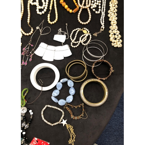 8067 - A large quantity of costume jewellery, necklaces, brooches, bracelets, earrings, etc.