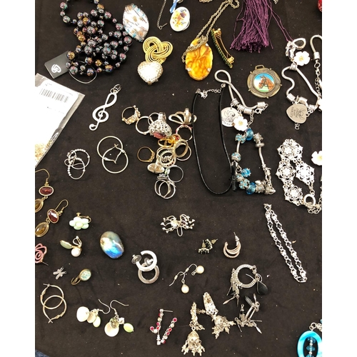 8067 - A large quantity of costume jewellery, necklaces, brooches, bracelets, earrings, etc.