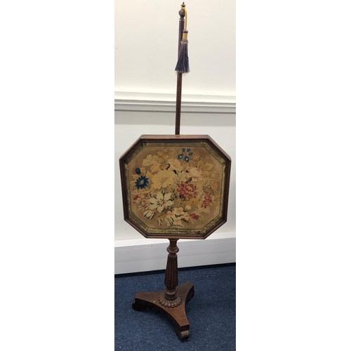 8075 - An adjustable fire pole screen with octagonal needlepoint floral centre panel, 149cm high overall.