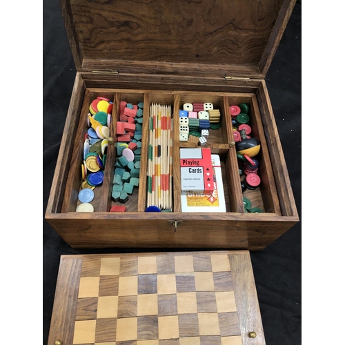 8079 - A wooden games compendium box, 28cm wide, 22.5cm deep, 15cm high with interior tray, draught board e... 