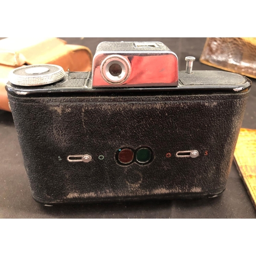 8091 - A vintage crocodile skin handbag, a similar wallet and an Agilux Agifold camera No.49476 (clip to cl... 