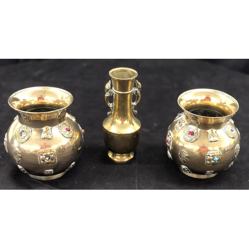 8097 - A pair of brass vases, 12.5cm high and a another brass vase, 15cm high. (3)