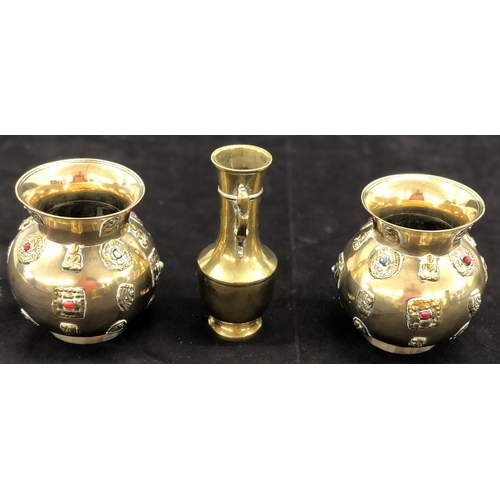 8097 - A pair of brass vases, 12.5cm high and a another brass vase, 15cm high. (3)