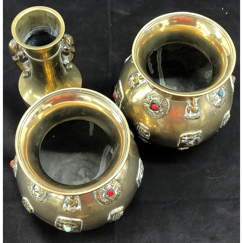 8097 - A pair of brass vases, 12.5cm high and a another brass vase, 15cm high. (3)