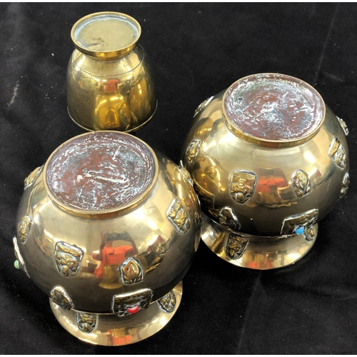 8097 - A pair of brass vases, 12.5cm high and a another brass vase, 15cm high. (3)