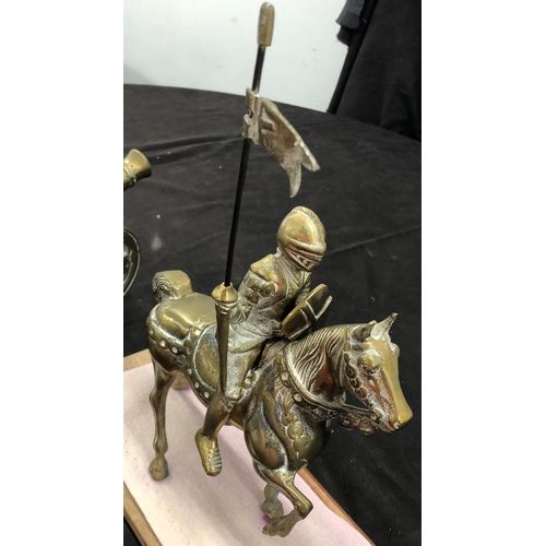 8099 - A solid brass knight on horse, 32cm high overall, with wood base, a brass table top canon etc.