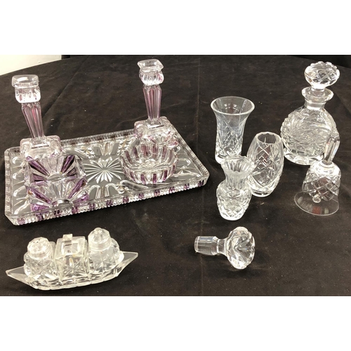 8102 - A purple tinted cut glass dressing table set, tray 30 x 20 cm with 2 candlesticks and 2 dishes, a bo... 